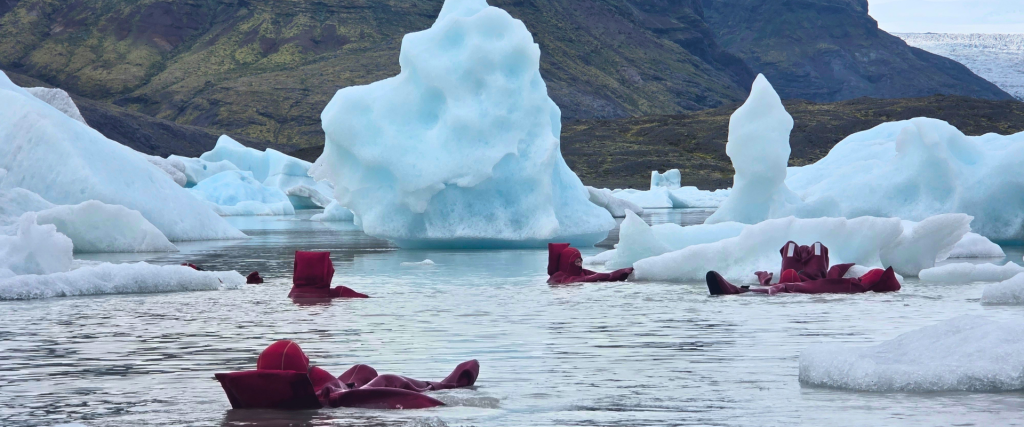 People ice floating at Fjallsárlón iceberg lagoon