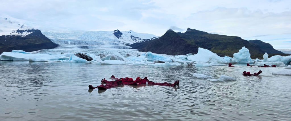 Group of people ice floating at Fjallsárlón.